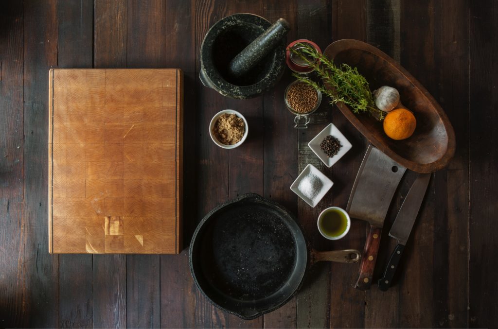 a tray with a tray of food and a knife on it