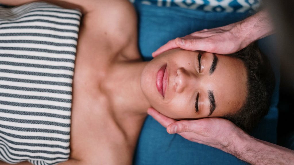 a person lying down with the eyes closed