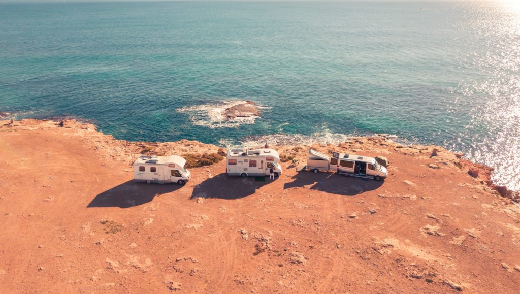 a group of houses on a beach