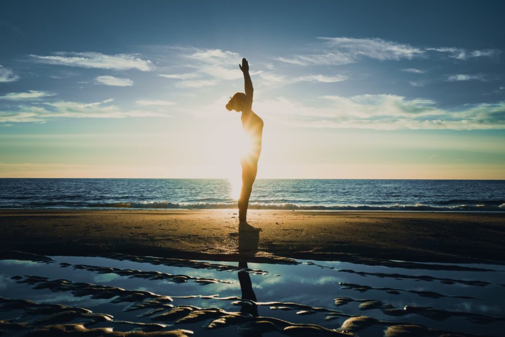 a naked man on a beach